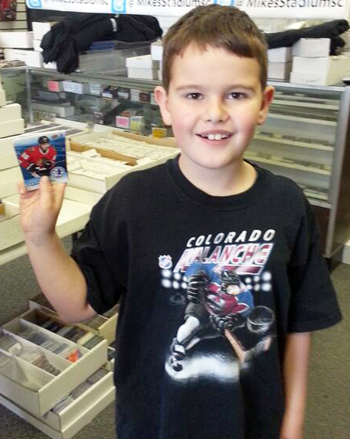 2014-Upper-Deck-National-Hockey-Card-Day-Young-Kid-Fan-Holding-Cards