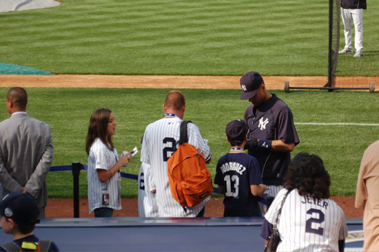 jeter2 Jeter signs for YSL contest winners including Madeleine Baxter, left, and Josh Adams (with backpack).