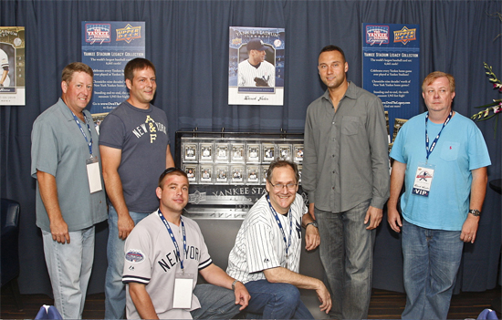 jeterwinners The five winners from Upper Deck’s Yankee Stadium Legacy Collection contest pose with Yankees Team Captain Derek Jeter alongside the YSL card collection that was on display at the NYY Steak restaurant in New York on June 16. From left: Kent Hayes, Tommy Baxter, Josh Adams, Leo Wiznitzer, Jeter and Chuck Sauter.