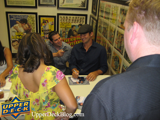 saturday-8 Tony chuckles while talking with reporter Jon Gold about the event while he signs photos for the members.