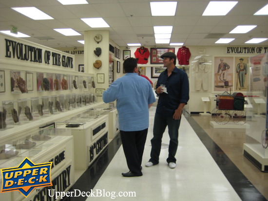 saturday-9 After signing, Tony mingled with members just taking in all the amazing exhibits at the museum. Upper Deck Diamond Club member Keith Spizzirri and Tony Romo talk about how far Baseball has come as they look at the evolution of the baseball glove.
